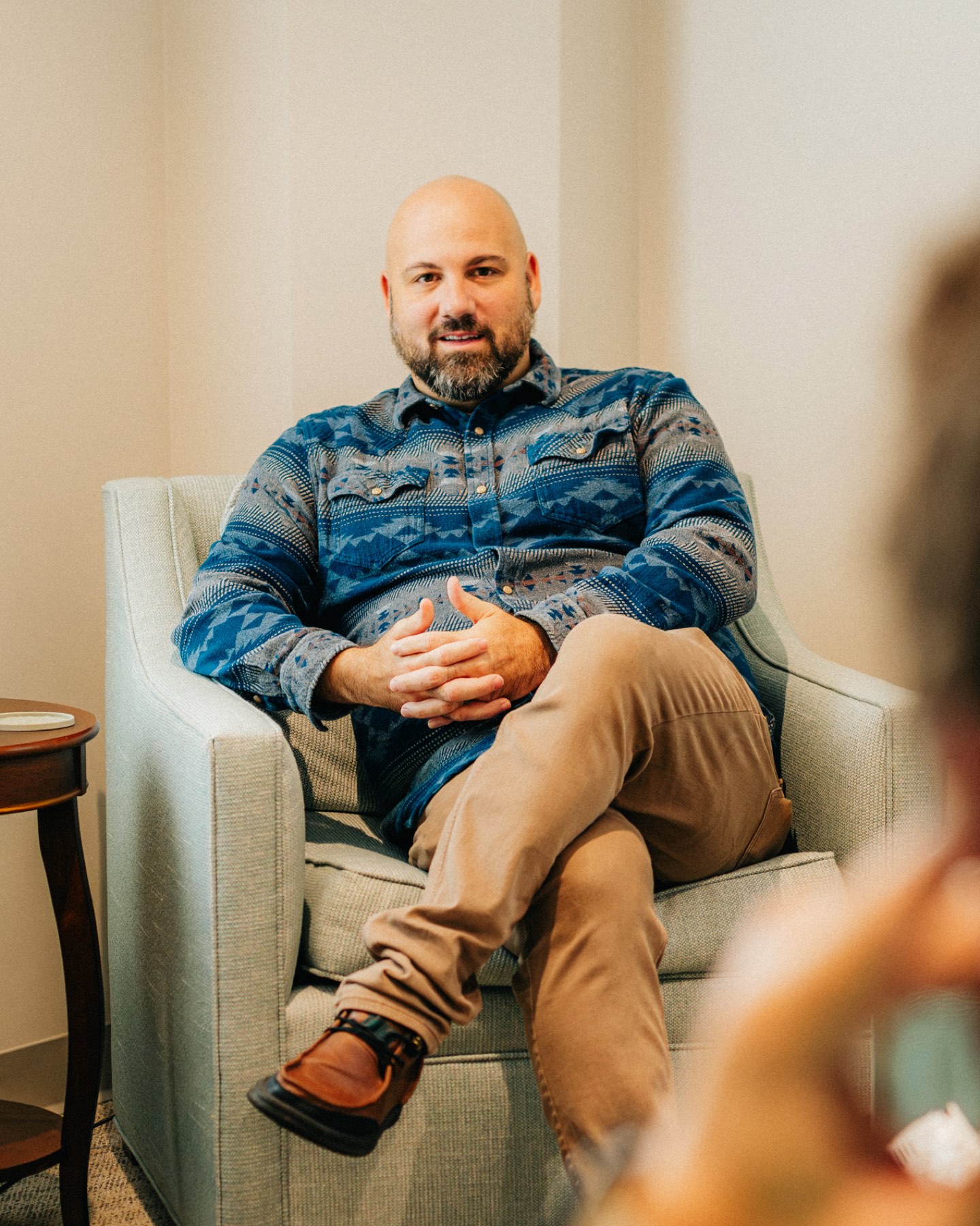 A provider talking with a client in his counseling room